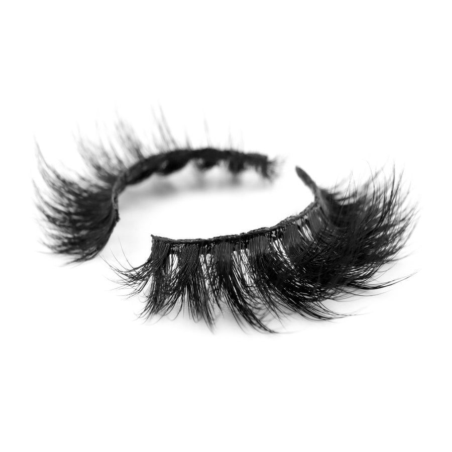 Suntarah Beauty 3D Faux Mink False Strip Eyelash in F-109.  Lash has dense, bold clusters and round shape.  It is shown at an angle against white backdrop.