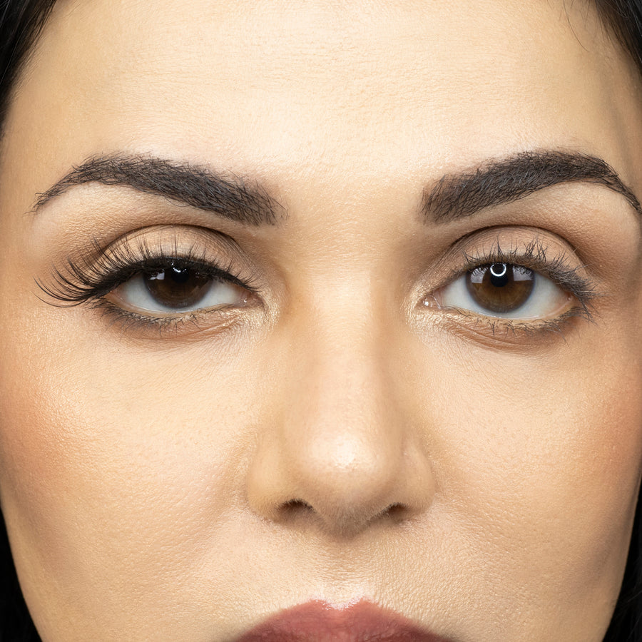  Close up picture of young woman wearing Suntarah Beauty 3D Premium Synthetic Strip Eyelash in Style S-221 on right eye only. There is a significant difference between her eyes.  Her right eye looks very sensual and sultry.  False lash looks very wispy, fresh, and foxy.