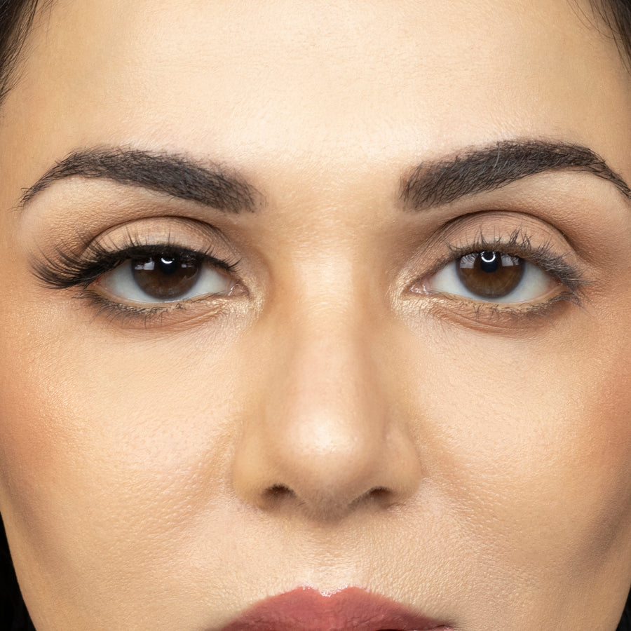  Close up picture of young woman wearing Suntarah Beauty 3D Premium Synthetic Strip Eyelash in Style S-222 on right eye only. There is a significant difference between her eyes.  Her right eye looks very sensual and sultry.  False lash looks very wispy, dreamy, and foxy.