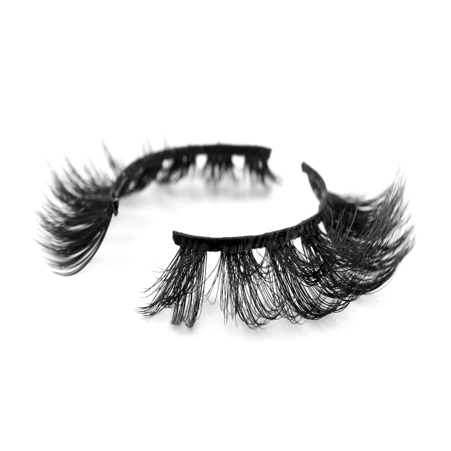 Suntarah Beauty 3D Premium Synthetic false strip lash in style S-223. Lash has maximum volume, a very round and clustered shape, and a black band. It is shown at angle against a white backdrop showing the strong curl of lash fibres.
