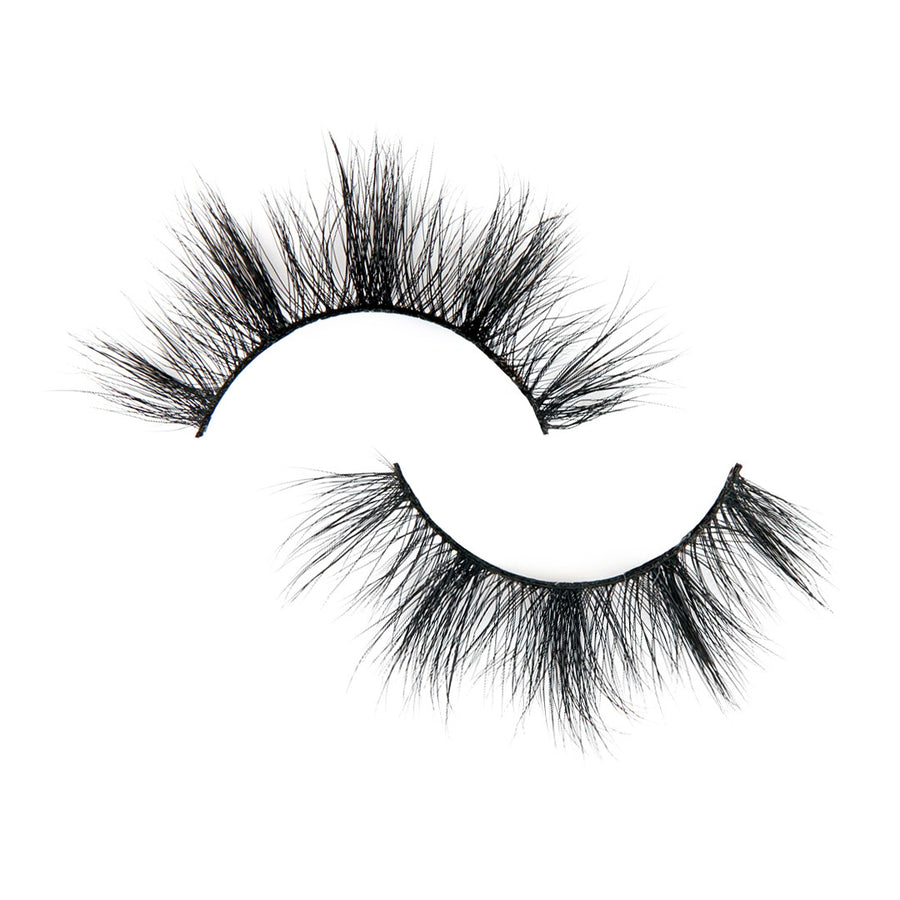 Suntarah Beauty 3D Faux Mink False Strip Eyelash in Style F-104.  Lash has medium-light clusters, a round shape, and a black band.  Lash is lying flat against a white backdrop. 