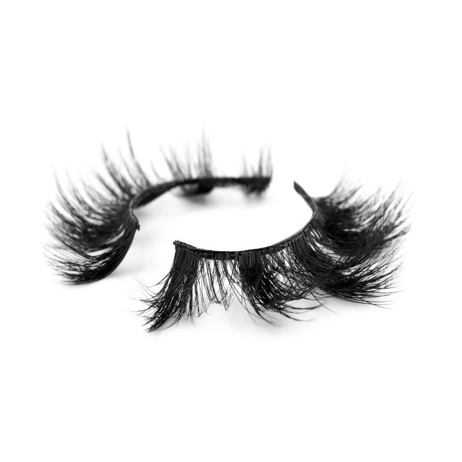 Suntarah Beauty 3D Faux Mink False Strip Eyelash in Style F-108 pictured at an angle against a white backdrop.  Lash has medium volume, dynamic clusters, and a round shape.  Lash has a black band.