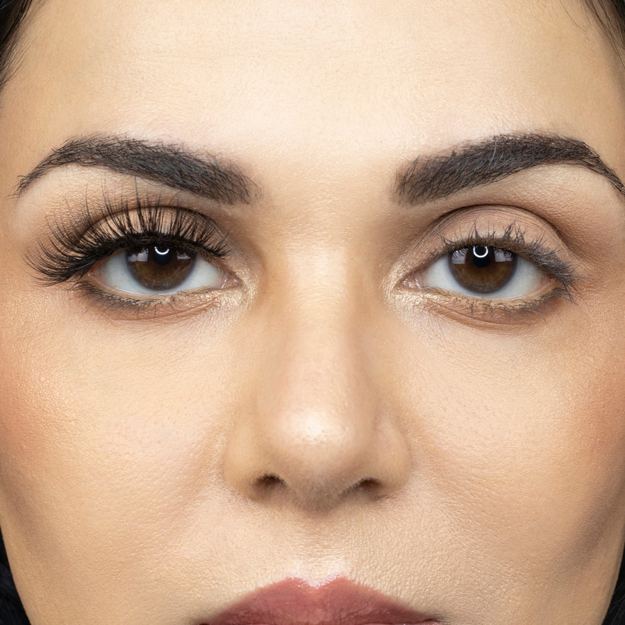  Close up picture of young woman wearing Suntarah Beauty 3D Premium Synthetic Strip Eyelash in Style S-220 on right eye only. There is a significant difference between her eyes.  Her right eye looks very accentuated with the glamorous and wispy lash.  