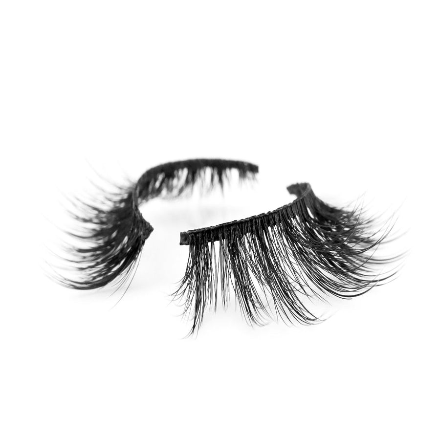 Suntarah Beauty 3D Premium Synthetic false strip lash in style S-221. Lash has medium volume, slightly tapered shape, and black band. It is shown at angle against a white backdrop showing the beautiful slight curl of lash fibres.