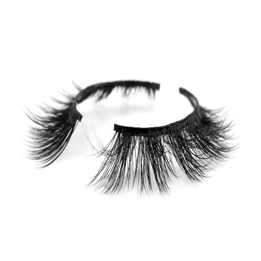Suntarah Beauty 3D Premium Synthetic false strip lash in style S-222. Lash has medium volume, very tapered and clustered shape, and black band. It is shown at angle against a white backdrop showing the slight curl of lash fibres.