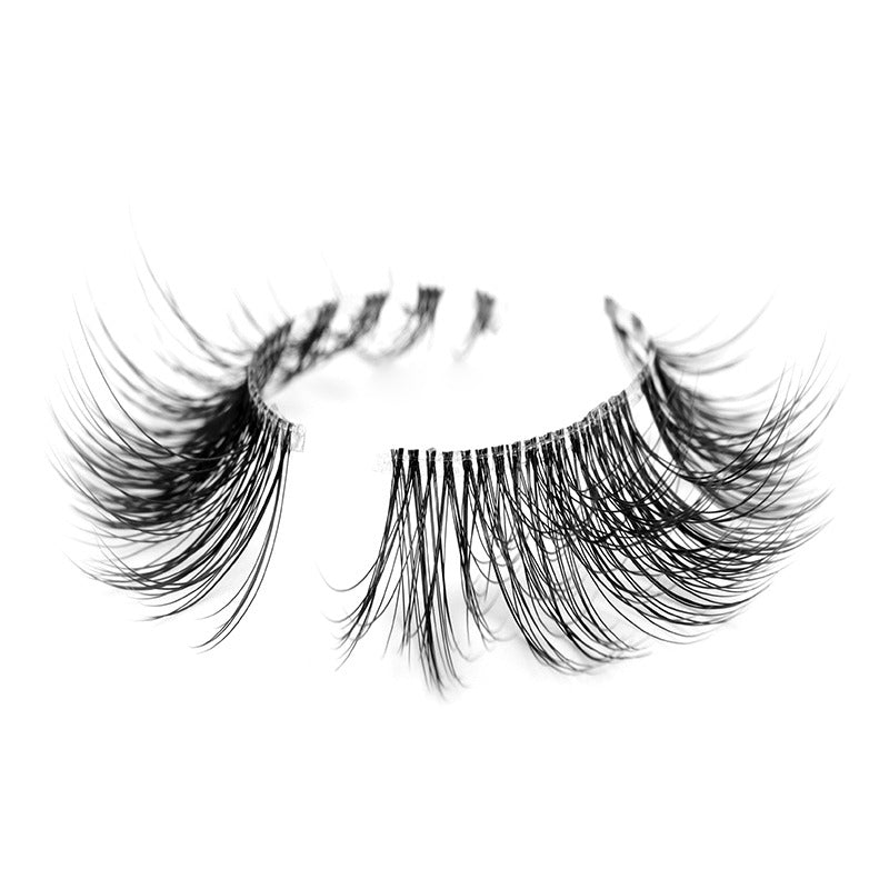 Suntarah Beauty 3D Ultra Light Synthetic false strip lash in style SL-330.  Lash has natural everyday volume, a round shape, and a thin clear band.  It has 4 small clusters of lash fibres towards inner corner of band, and then continues without clusters.  It is shown at angle against a white backdrop showing the beautiful curl of lash fibres.
